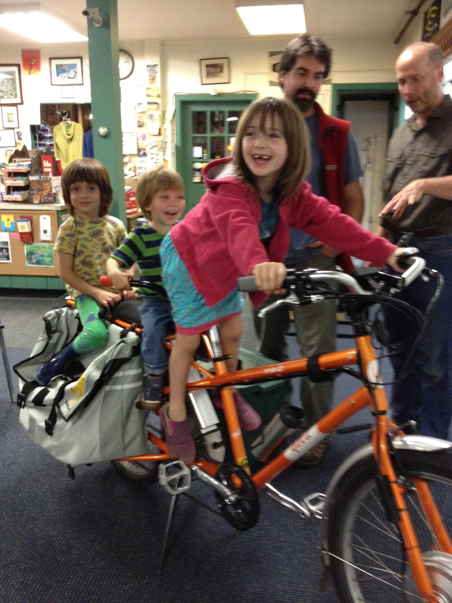 Young family checking out the bikes at Burrows